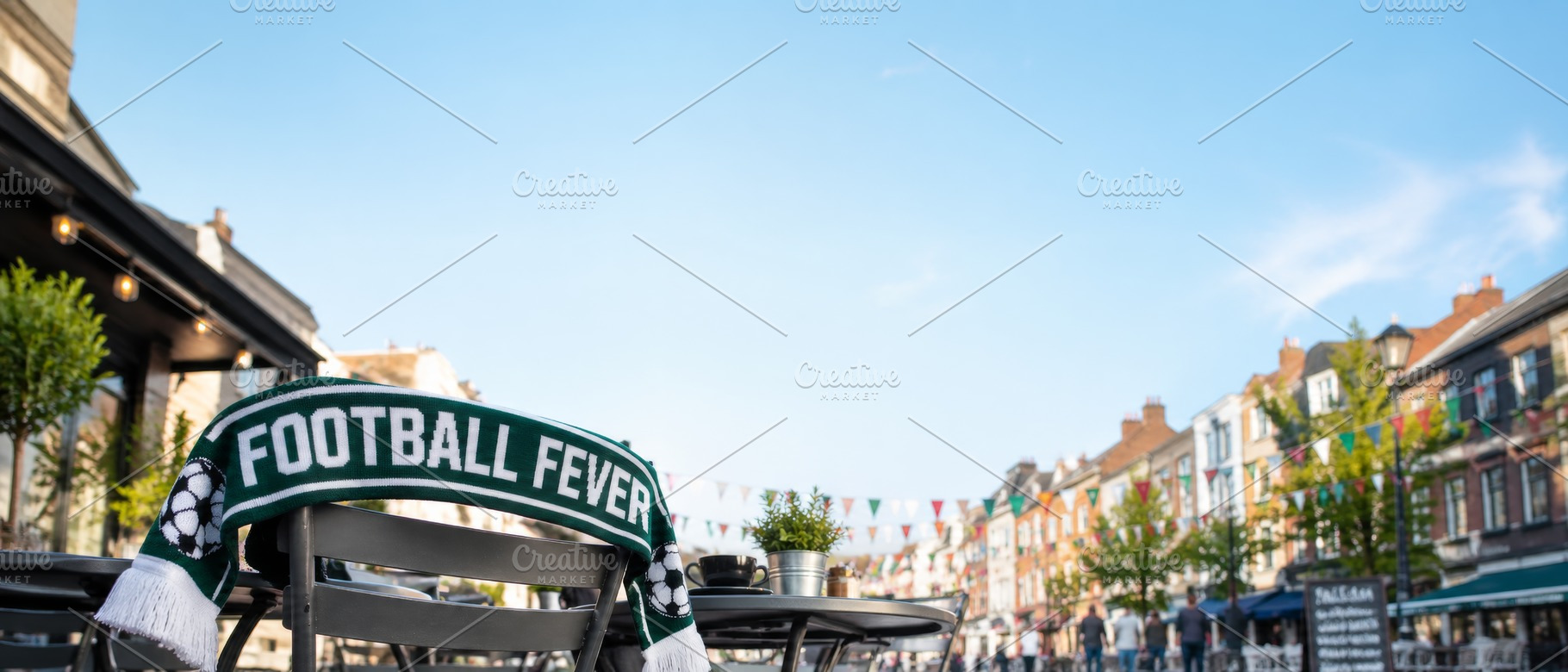 Football scarf on chair in vibrant o, a Photo by Dvoevnore photos