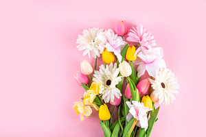 Beautiful spring flowers bouquet on pastel pink background, a Holiday Photo by Rimma