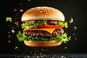 Juicy hamburger floating in the air with ingredients, a Food & Drink Photo by GoodGoods (Thumbnail 2 of 2)