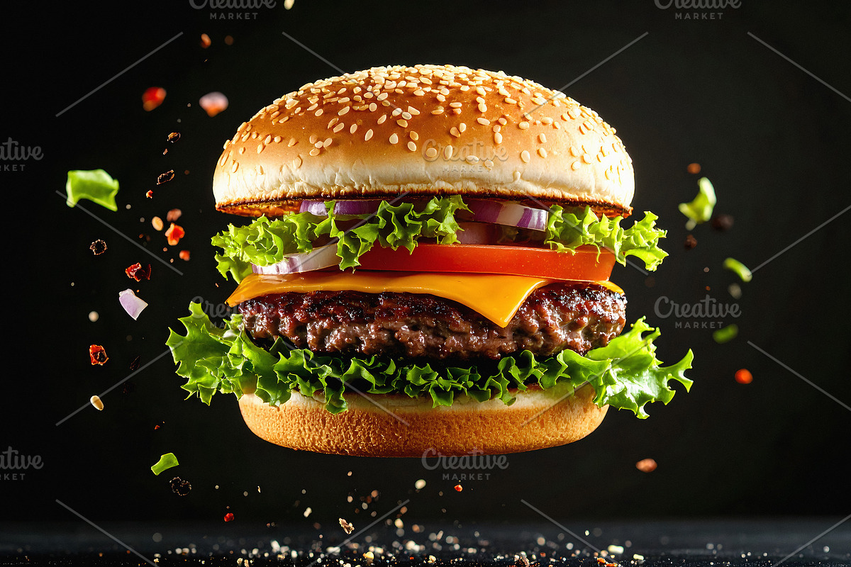 Juicy hamburger floating in the air with ingredients, a Food & Drink Photo by GoodGoods (Photo 2 of 2)