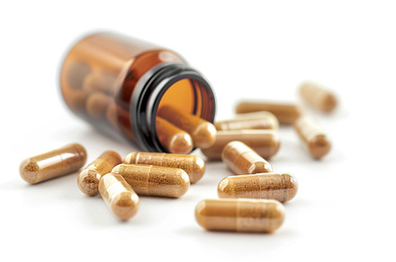 Medicine pills and glass bottle on white background, a Health & Medical Photo by AlyaAnd