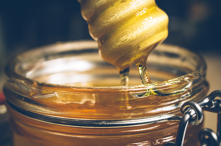 Pouring honey containing honey, food, and dinner