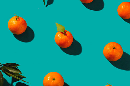 Tangerines on a turquoise background, a Food & Drink Photo by Valeriia • Svitlini