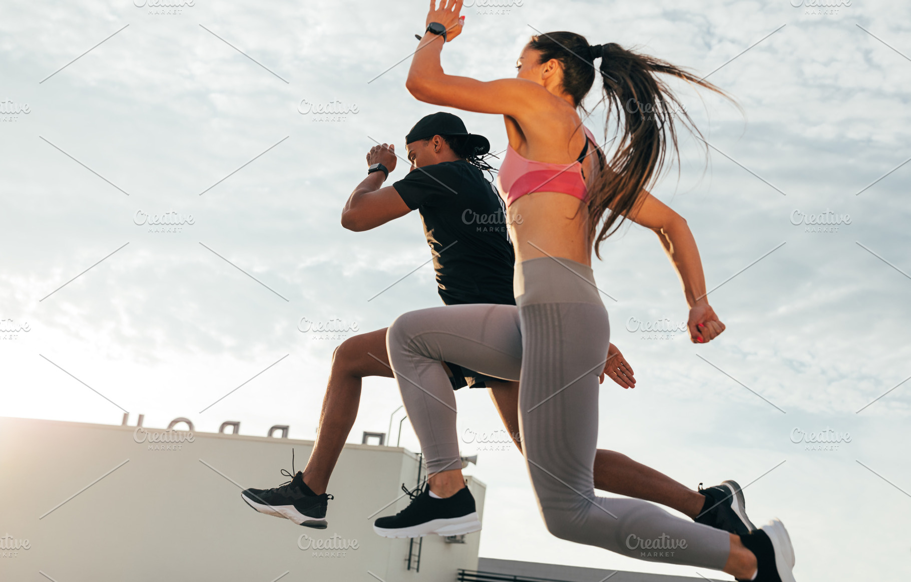 Two athletes jumping in the air, a Sports & Recreation Photo by Artem Varnitsin