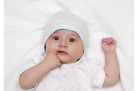 Cute baby lies on a white background, a Person Photo by shahin.mammadov