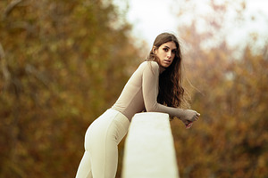 Elegant woman leaning on a railing i, a Person Photo by Perpis