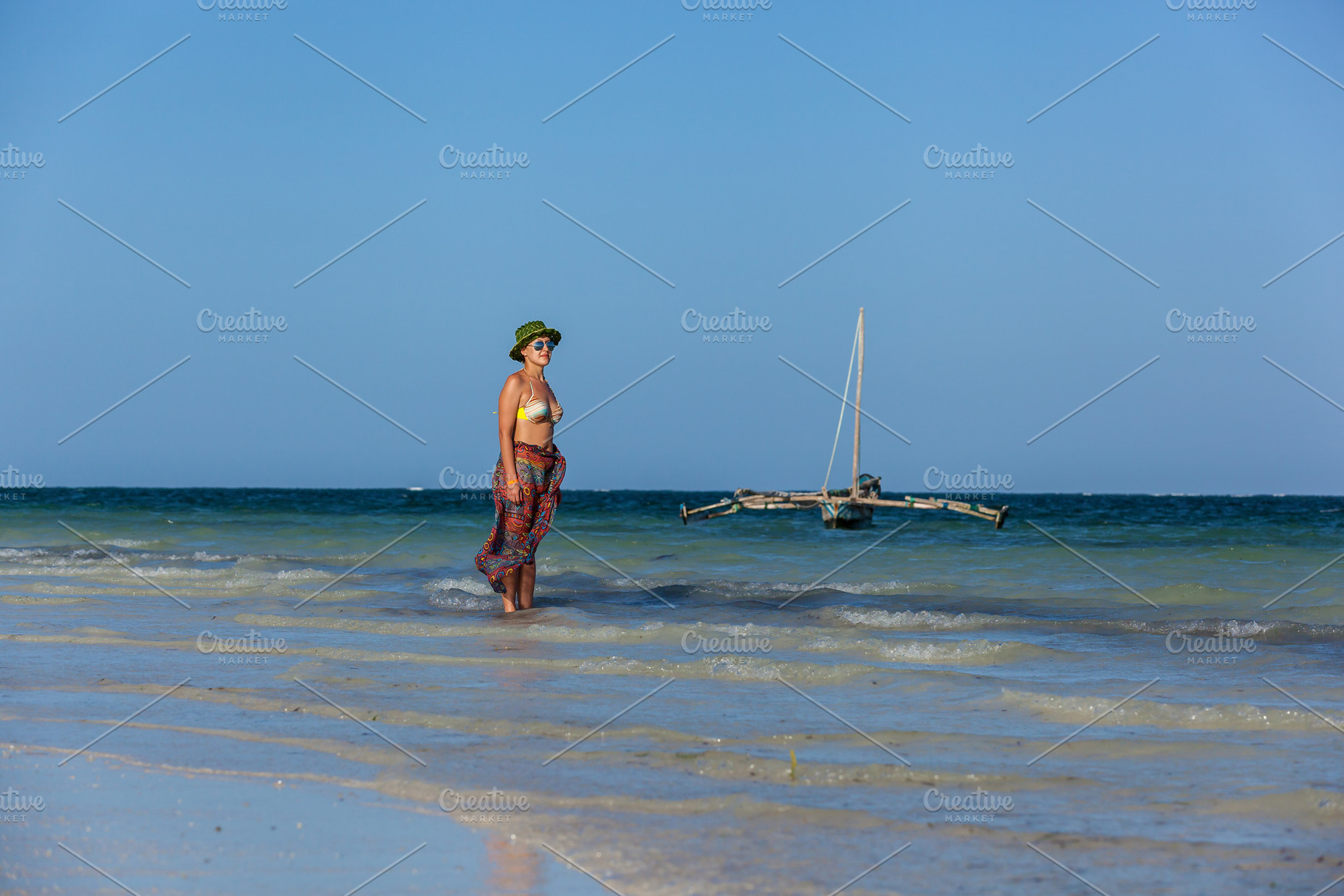 Girl walks on the beach, a Person Photo by Photostock