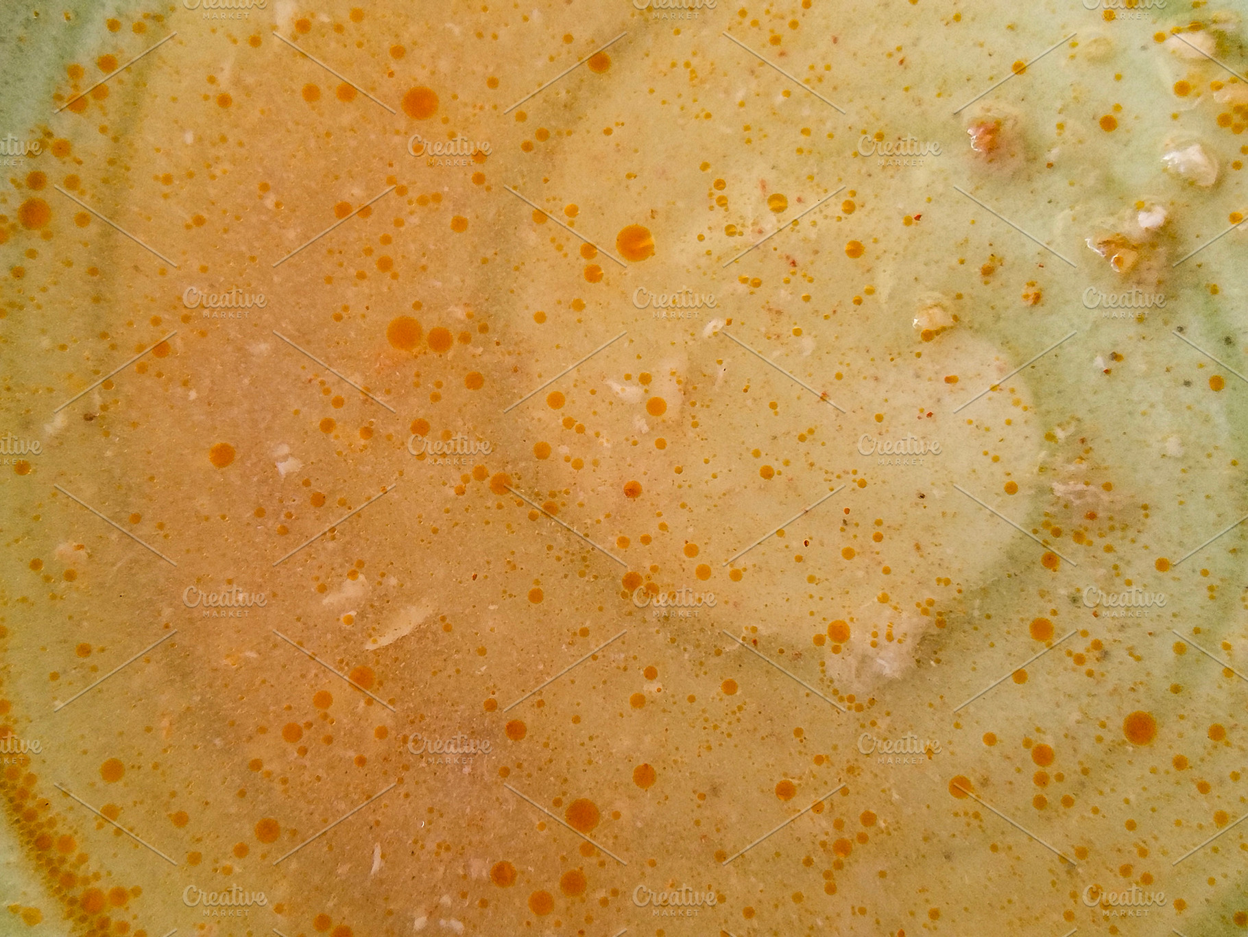 Close-up of hot oily soup surface, a Food & Drink Photo by DanFLCreativo