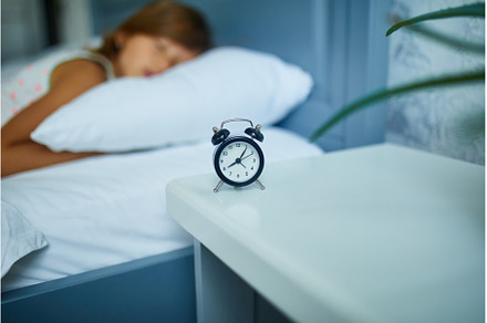 Little girl sleeping on a big and, a Person Photo by IlliaBondarPhotography
