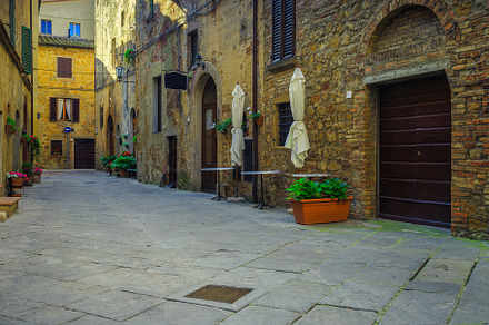 Street with flowers and flowerpots, an Architecture Photo by Alpine Dreams