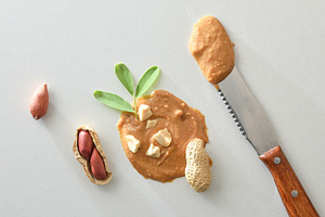 background concept detail peanut butter on white table, a Food & Drink Photo by Davizro's Market