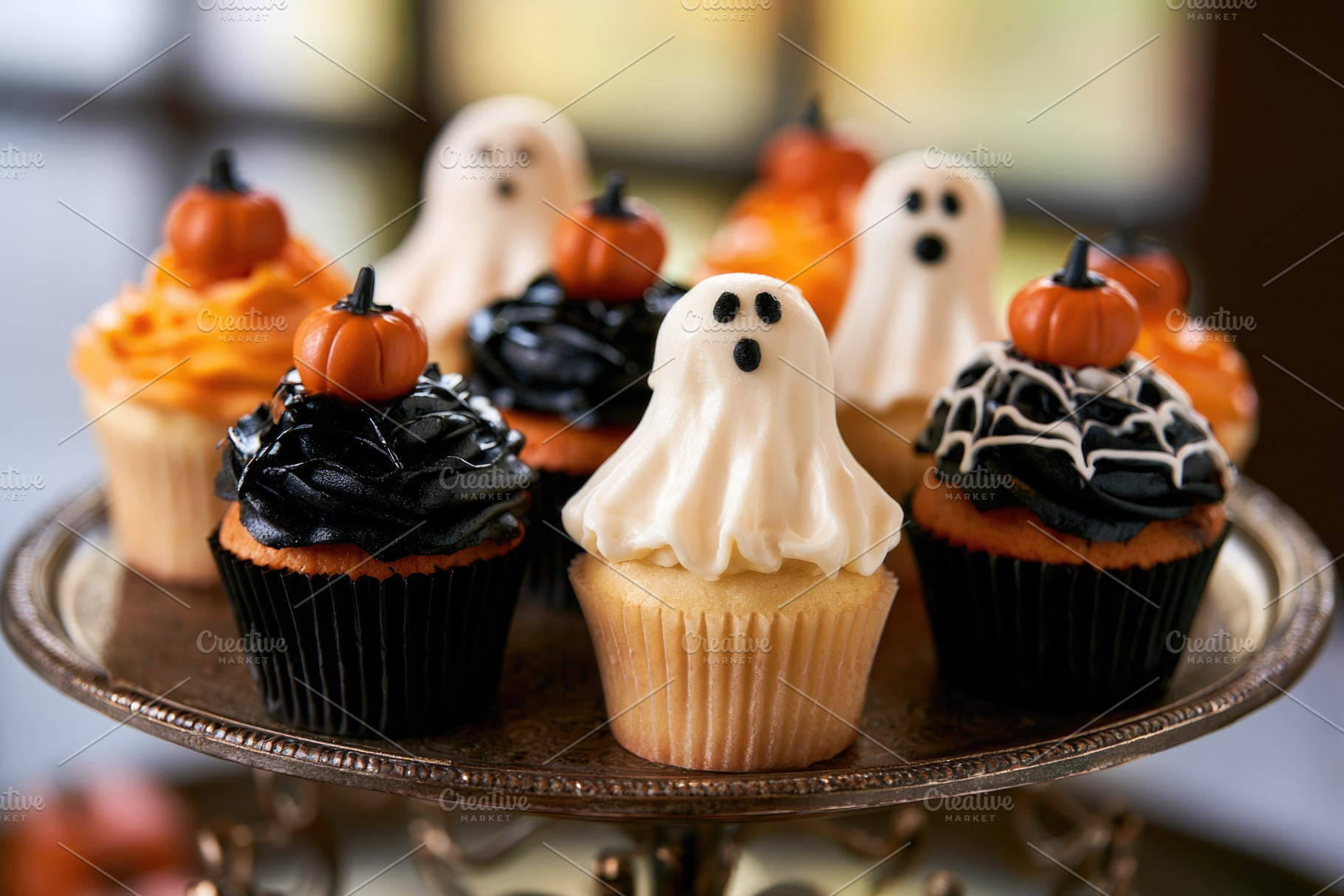 Halloween cupcakes with ghost toppers and spider web frosting, a Food & Drink Photo by José Manuel Gelpi