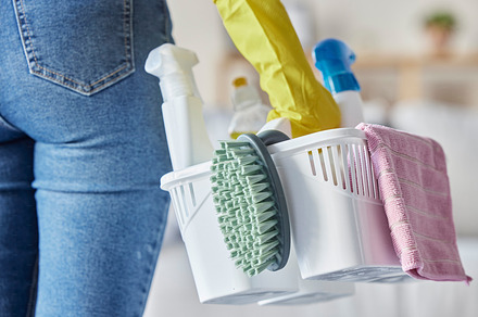 House, cleaning products and woman hands holding plastic container with cleaner tools. Home, cleaning service and chemical spray bottle of a person ready for spring clean with brush in a basket, a Photo by Peopleimages.com