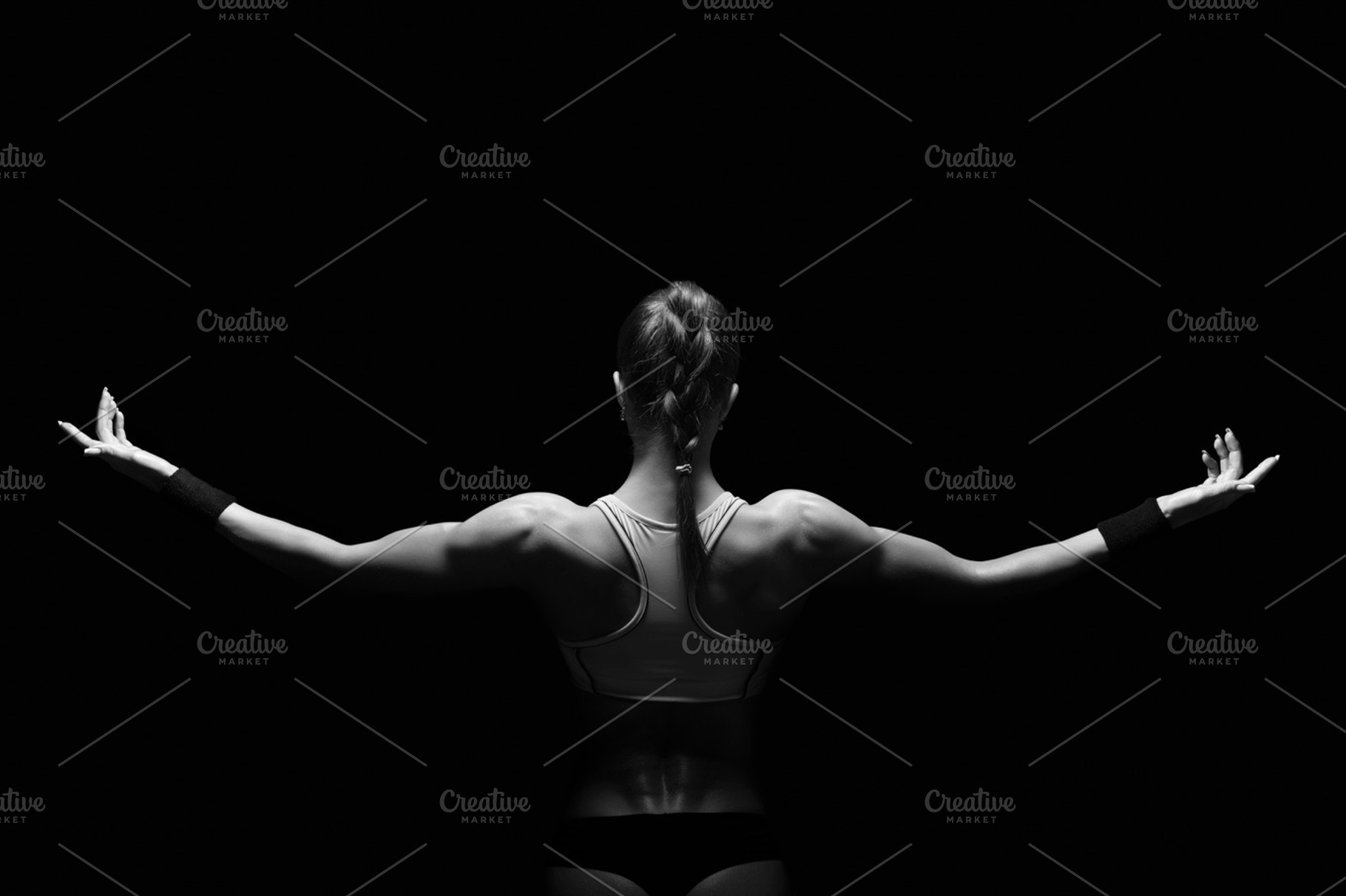 Athletic young woman showing muscles stock photo containing active and adult, a Sports & Recreation Photo by sport&beauty stock photo