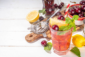Summer cold refreshment cocktail with cola cherry juice, a Food & Drink Photo by Rimma