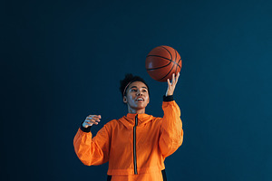 Young woman in orange sportswear, a Sports & Recreation Photo by Artem Varnitsin