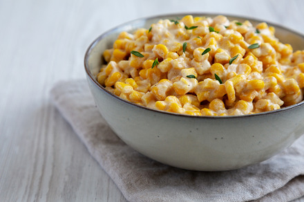 Homemade Slow Cooker Creamed Corn in a Bowl, low angle view., a Food & Drink Photo by LiudmylaChuhunova