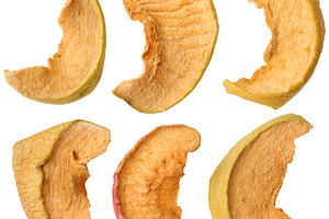 Dried apple slices on isolated background, a Food & Drink Photo by ndanko
