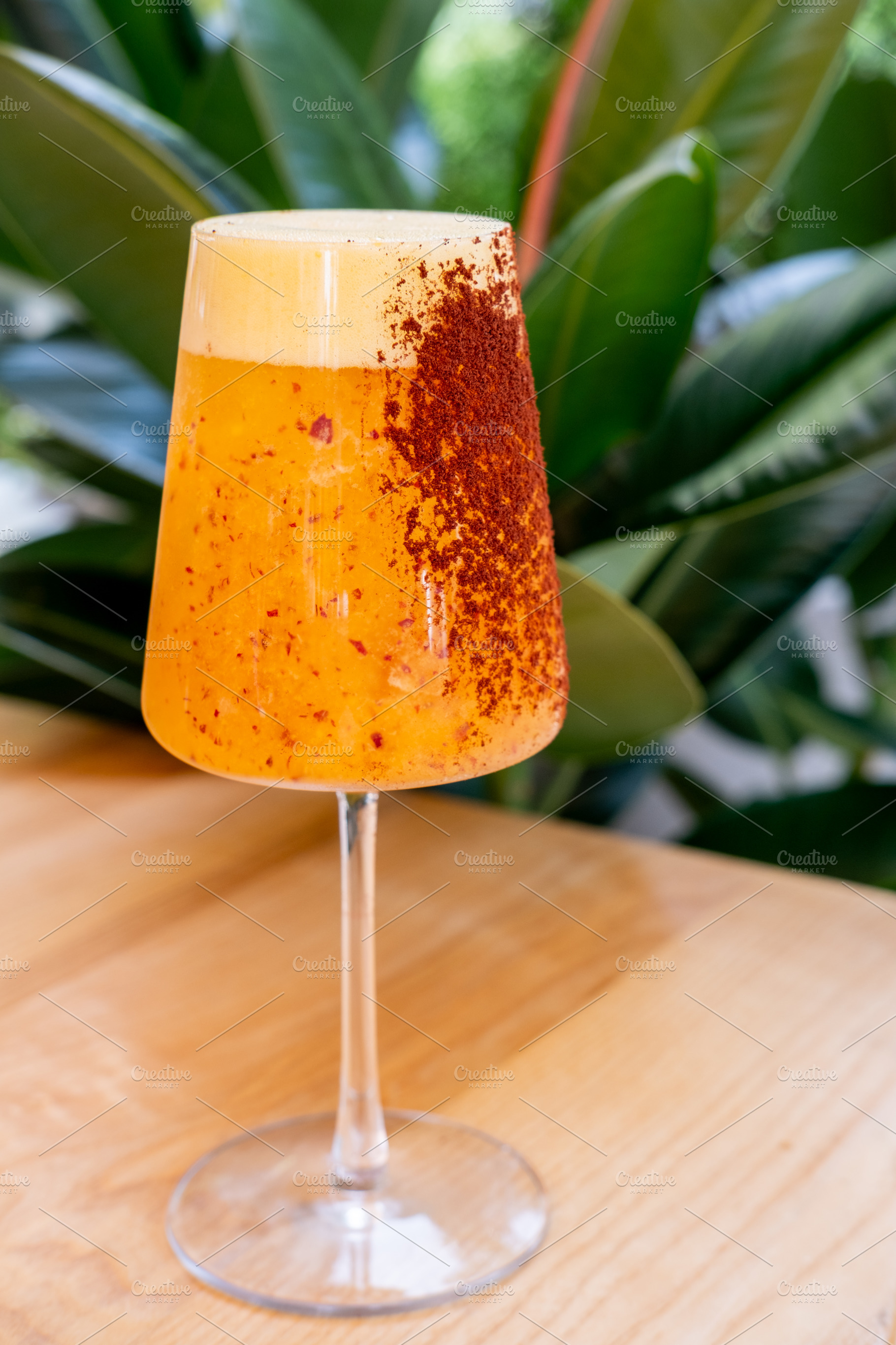 Spiced orange cocktail exotic drink glass leaves, a Food & Drink Photo by Photo Drive Studio