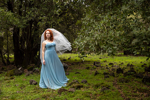 Woman in a flowing blue dress and br, a Person Photo by Imaginarium