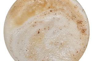 A round surface of cappuccino coffee foam with streaks and cinna, a Food & Drink Photo by ndanko