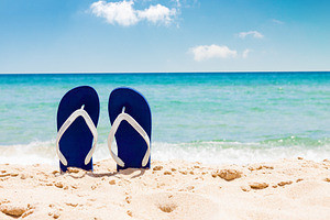 Flip flops on tropical sand beach, a Holiday Photo by BOOCYS