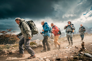 Group of ordinary senior hikers trek, a Person Photo by DanFLCreativo