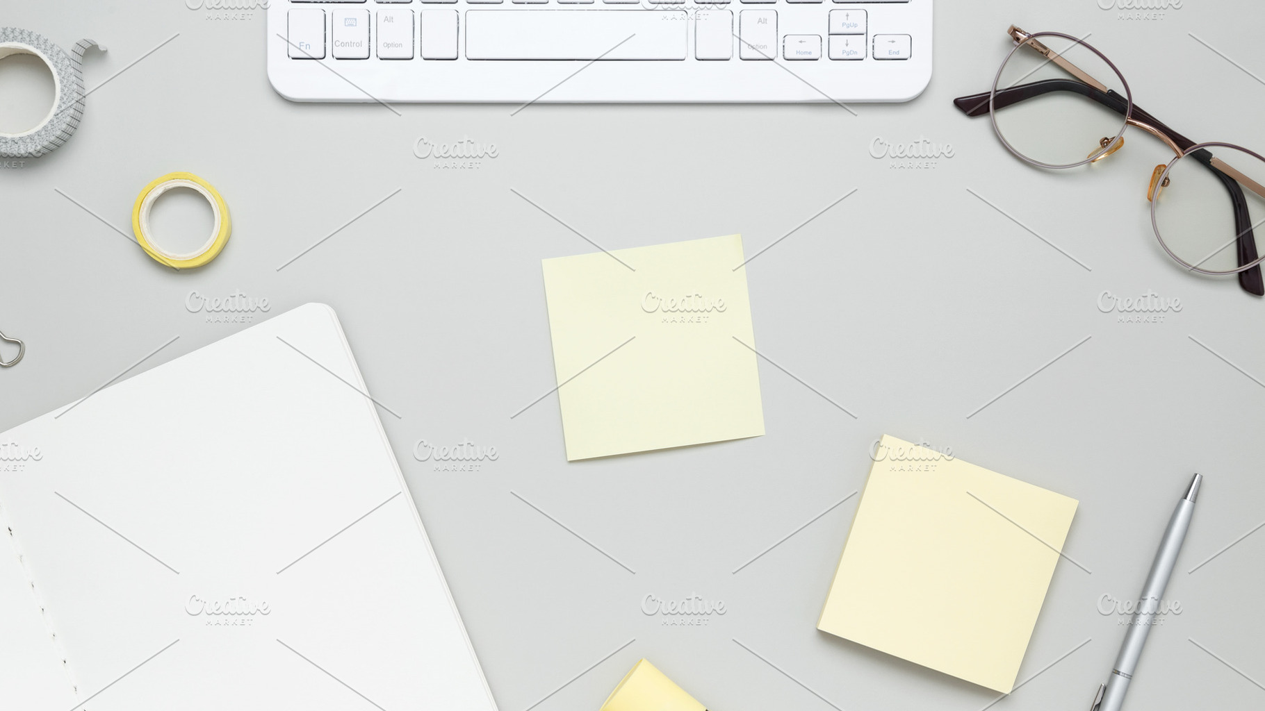 Productive workspace arrangement featuring keyboard, stationery, glasses and no, a Photo by matucha