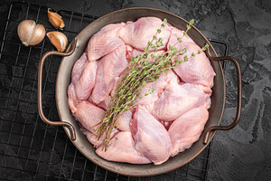 Raw quail breast fillets with thyme and garlic in a metal pan on, a Food & Drink Photo by composter-box@mail.ru