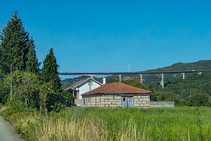 Empty rural scene with houses and bridge, an Architecture Photo by DanFLCreativo