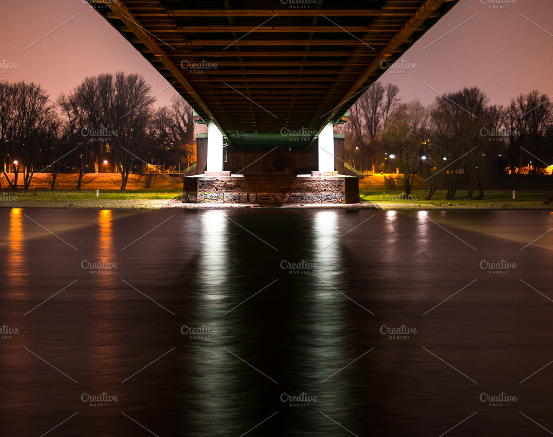 Under the bridge during the night, an Industrial Photo by Nex Apher