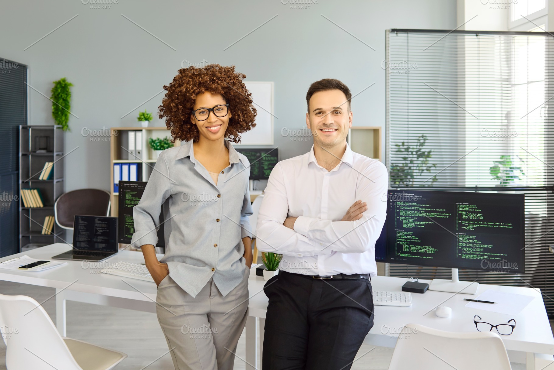 Two Smiling Developers in Office, a Person Photo by StudioRomantic
