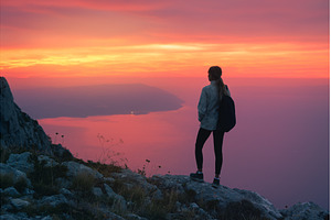 Women hiker with backpack standing, a Nature Photo by den-belitsky