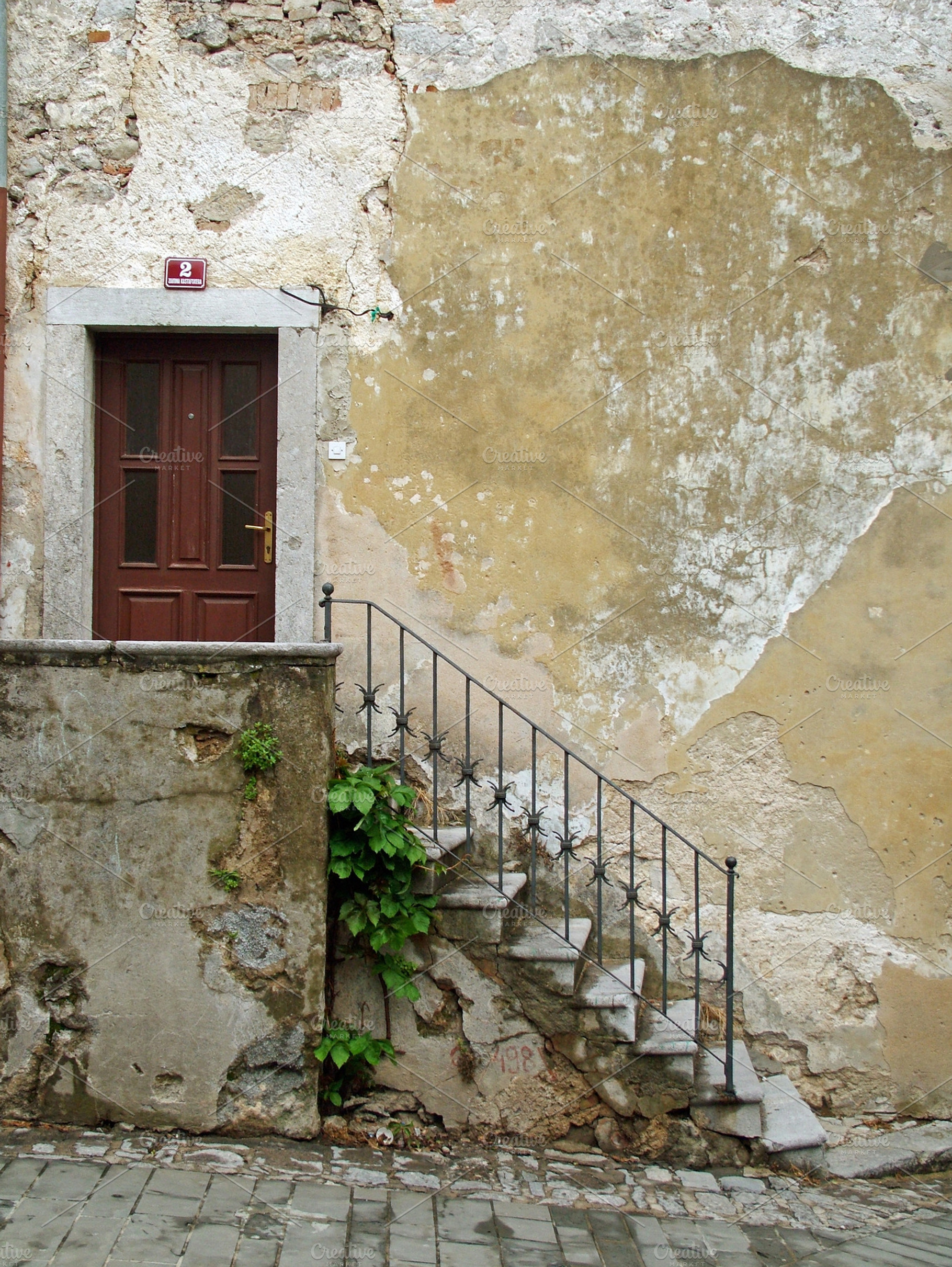 Door containing wall, stairs, and home