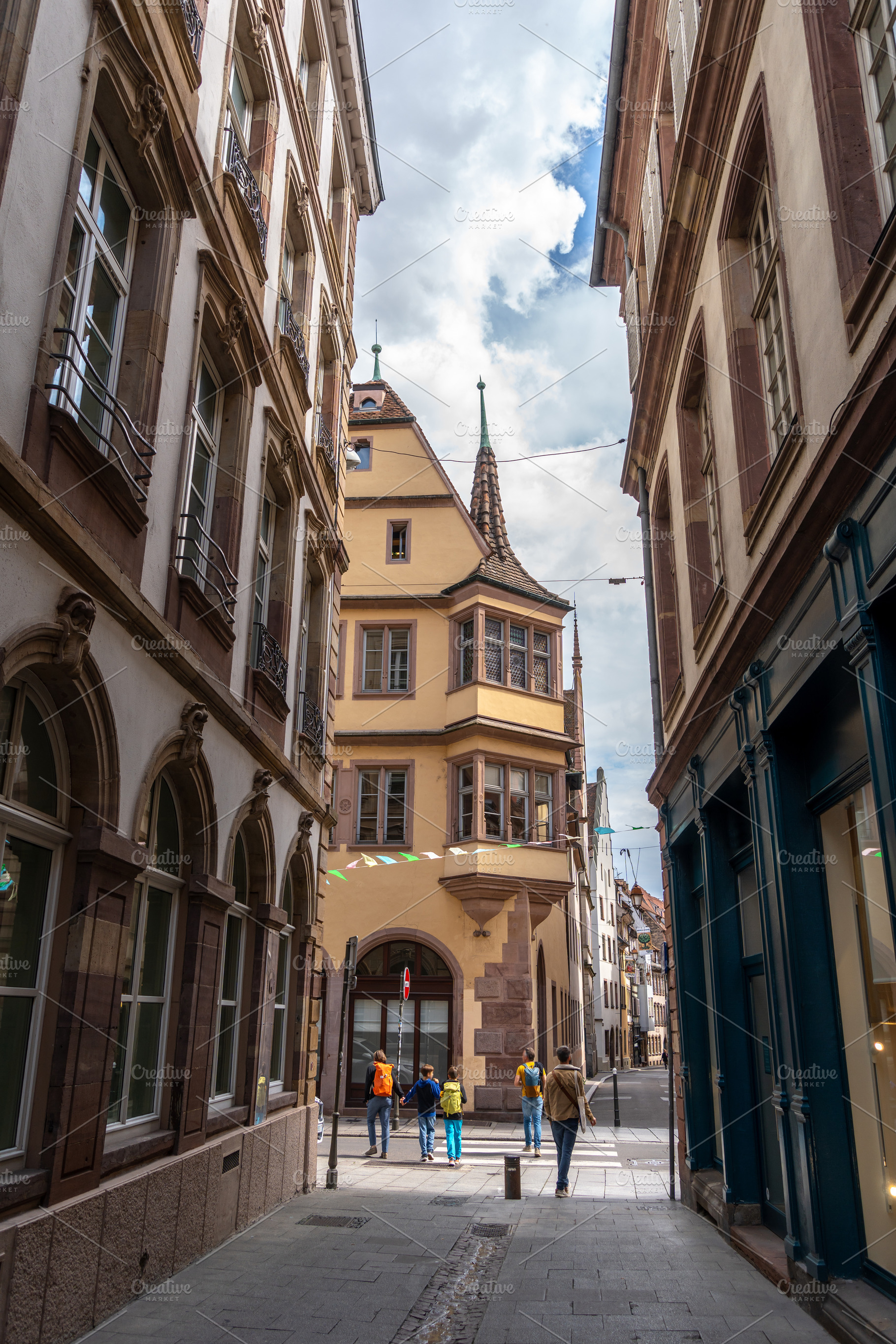 Narrow street with historic buildings in Strasbourg, France, an Architecture Photo by GoodGoods
