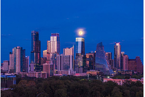 Harvest moon in the Austin skyline, an Architecture Photo by Backyard Stock