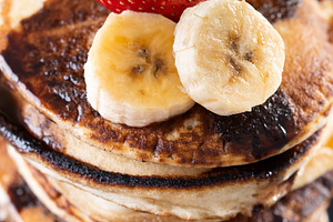 Pancakes with chocolate and fruit on wooden table, a Food & Drink Photo by etorres69