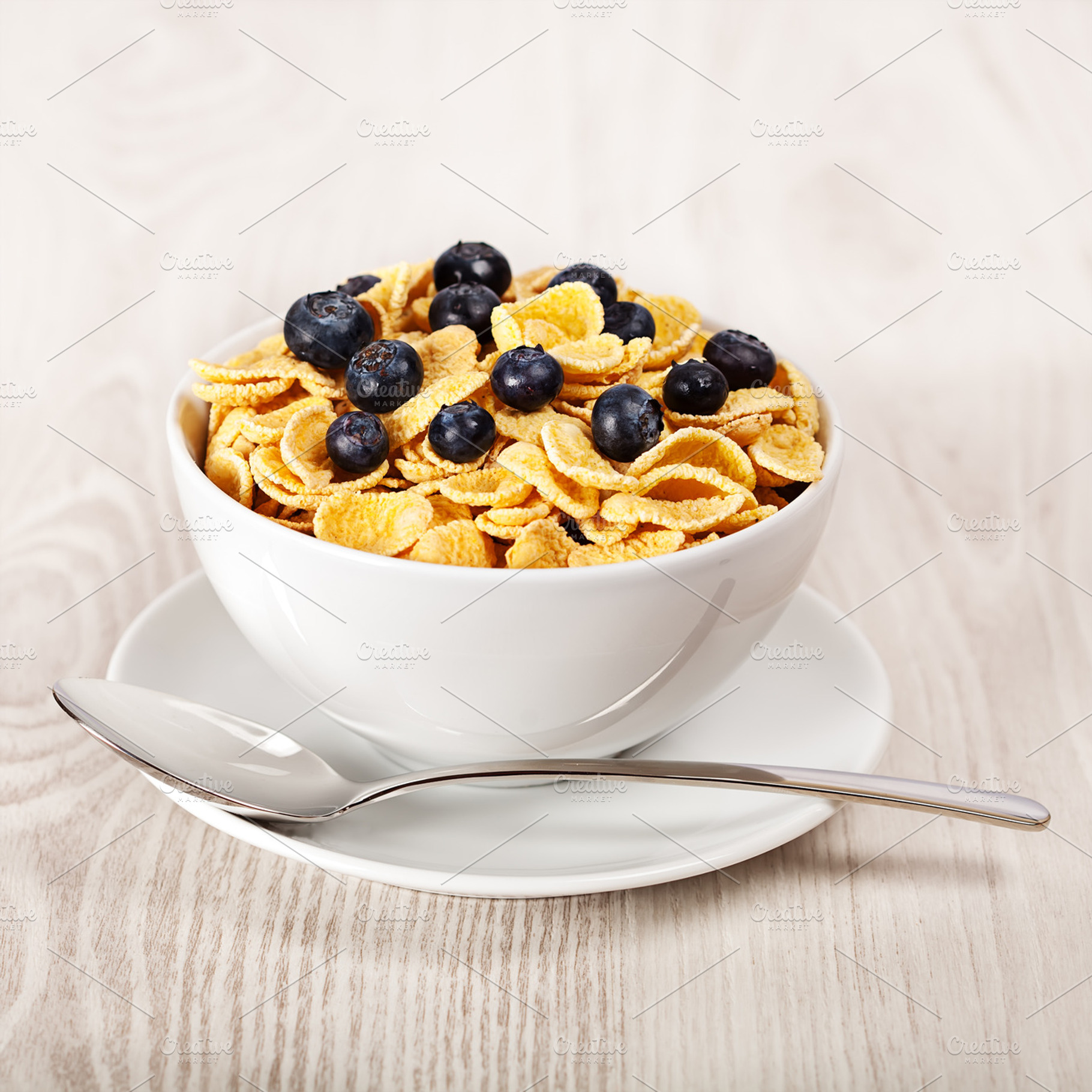 Corn flakes with blueberries breakfast containing background, berry, and blue