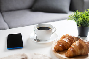 Coffee and Croissants Breakfast with Smartphone on White Table, a Food & Drink Photo by etorres69