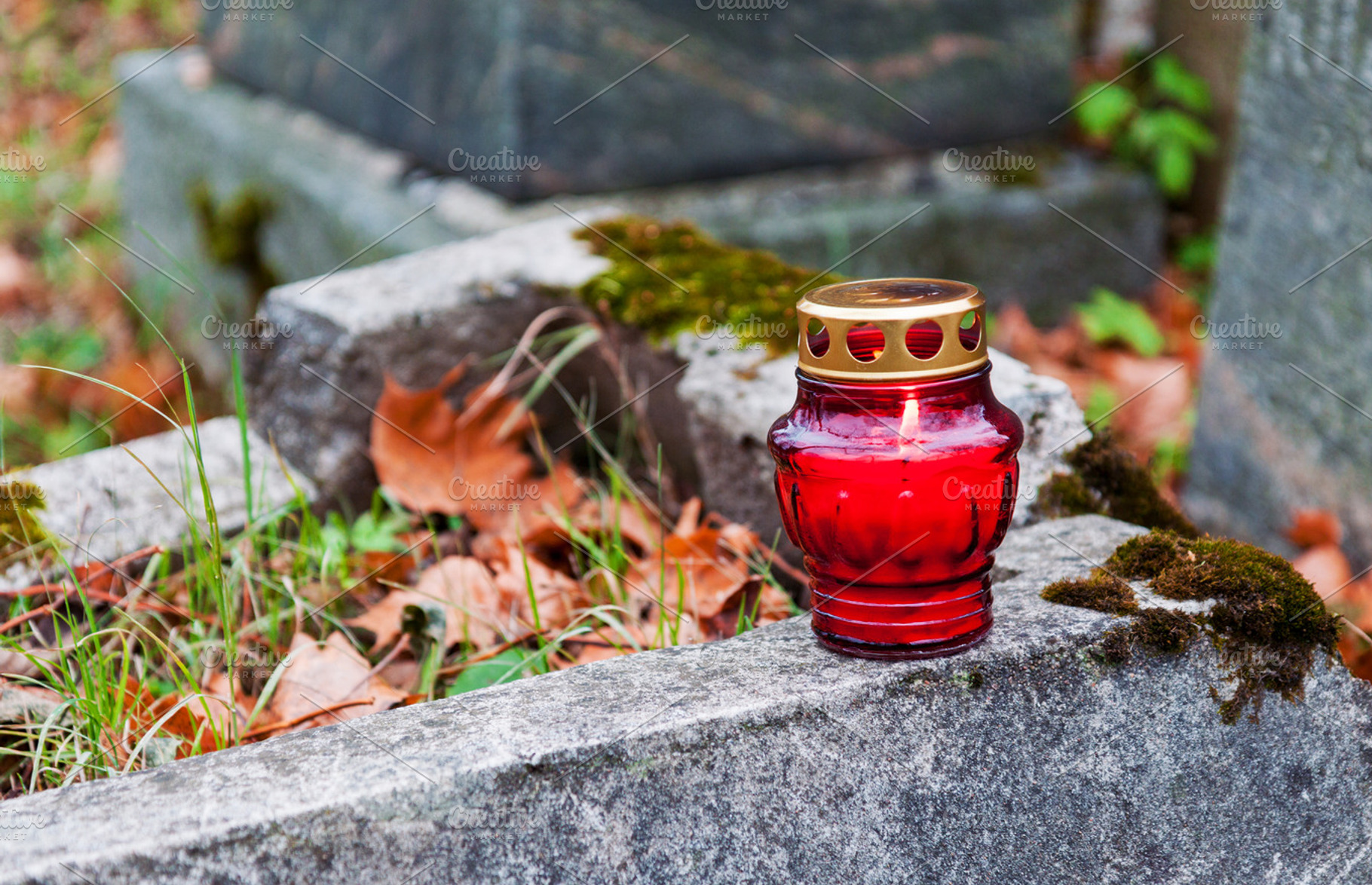 Burning cemetery candle, a Holiday Photo by BOOCYS