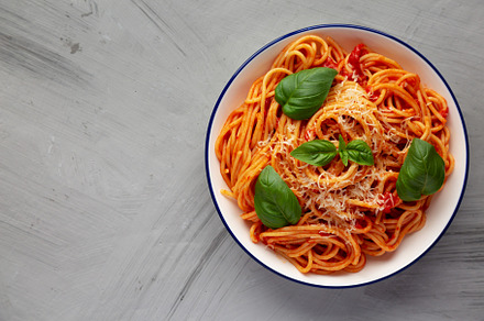 Homemade Pasta Pomodoro on a Plate, top view. Flat lay, overhead, a Food & Drink Photo by LiudmylaChuhunova