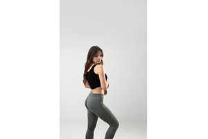 Confident young woman in activewear, a Person Photo by volodymyrshtun13795