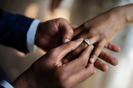 Groom put on wedding ring to bride containing holding, people, and together, a Person Photo by rawpixel