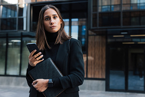 Young businesswoman in black formal, a Business Photo by Artem Varnitsin