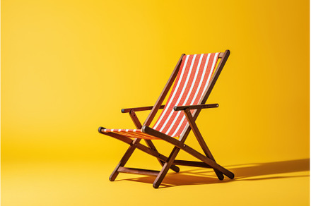 Sunbathed Deck chair. Generate Ai, a Sports & Recreation Photo by Ylivdesign