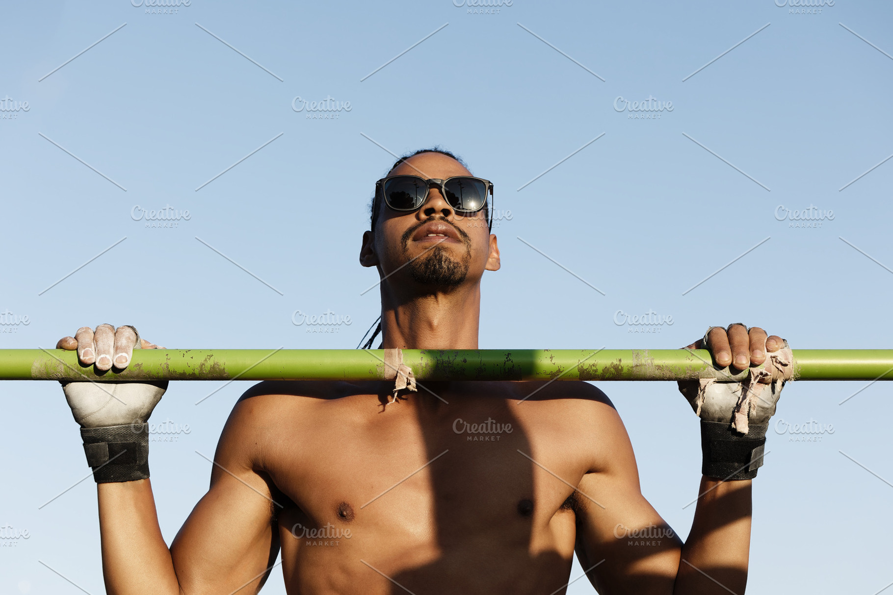 Athlete training with pull-ups outdo, a Sports & Recreation Photo by Perpis