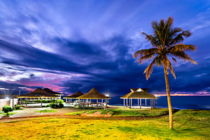 Tropical thatched gazebos at sunset in Hanga Roa, Easter Island, a Nature Photo by Leonid Andronov