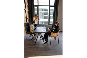 Female executives conducting work, a Business Photo by undrey