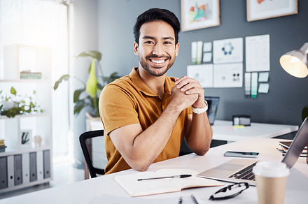 Confidence, success and portrait of a businessman in the office while working on project with laptop. Happy, smile and professional male employee planning corporate report with computer in workplace., a Photo by Peopleimages.com