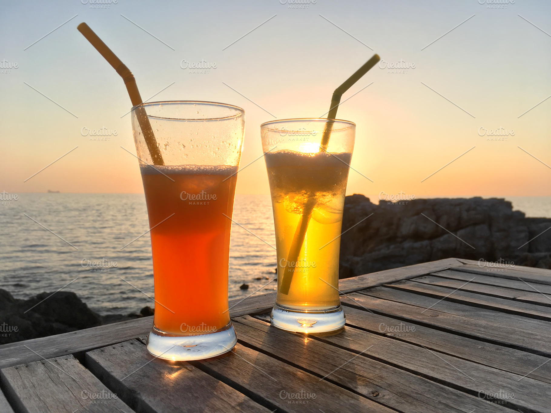 Frozen cocktail glasses over sunset, a Food & Drink Photo by Vapi